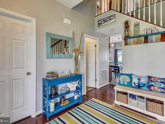 Spacious foyer with hardwood floor.