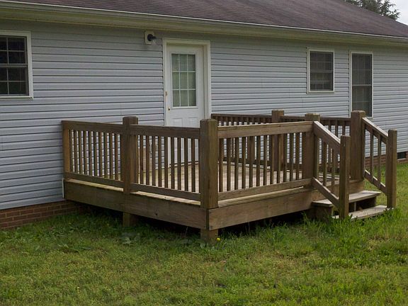 Broad wooden deck in back