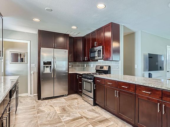 Kitchen with all major stainless steel appliances and gas stove included