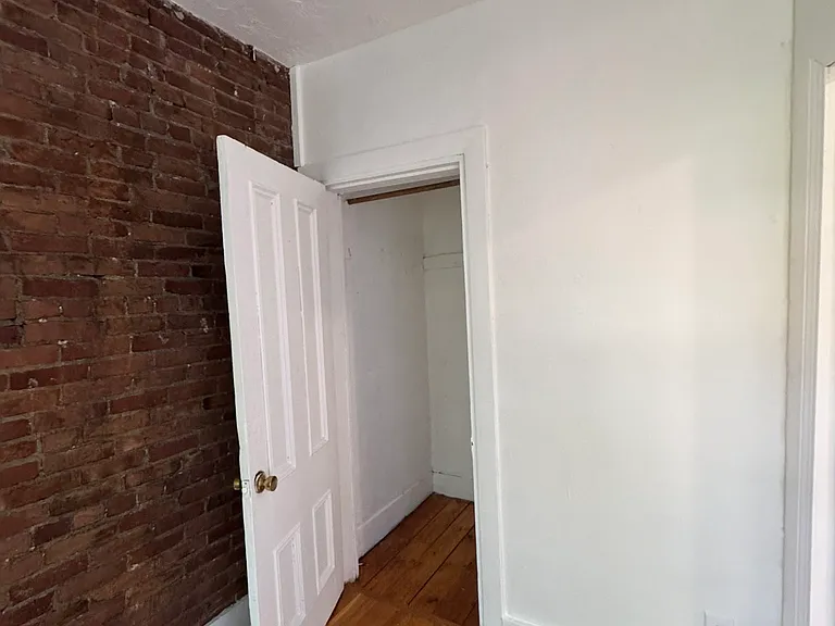 East Facing Window Room with Charming Southend Exposed Brick Wall + Closet Picture 2