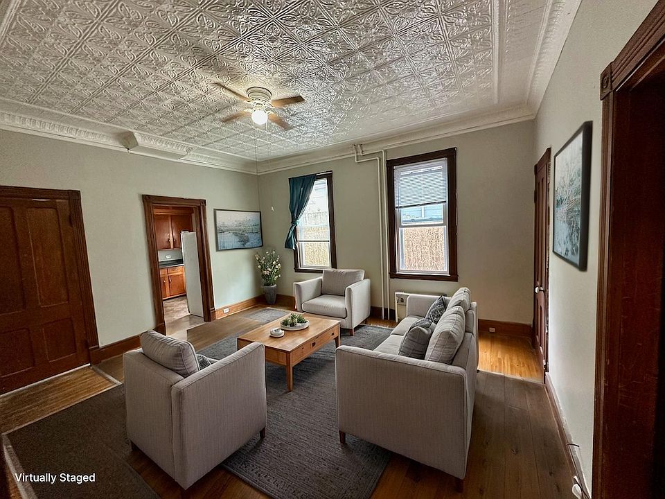 Spacious living room with high ceilings, carpet and hardwood!
