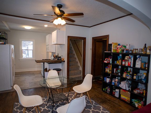 Dining room with open concept design from living room through to the kitchen.