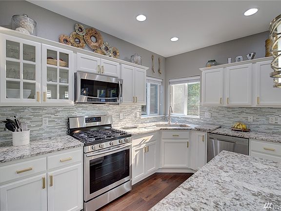 This kitchen is breathtaking!  Beautifully remodeled with new cabinets, granite counters and appliances.  