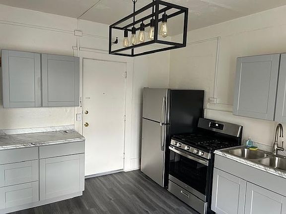 Newly remodeled kitchen with ample cabinet space and counter tops.
