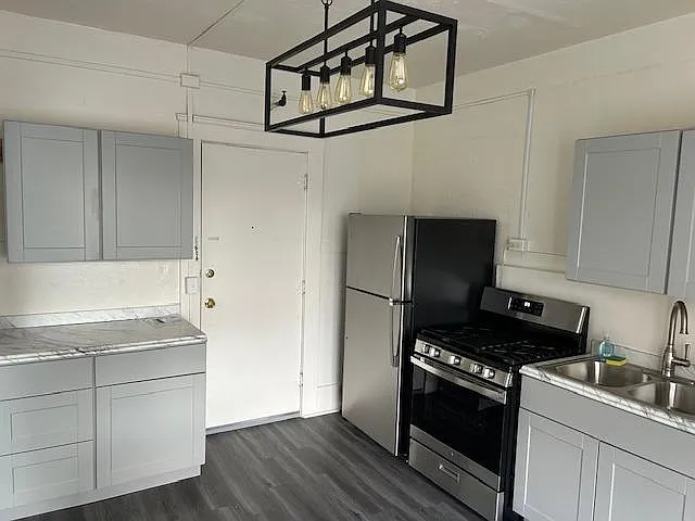 Newly remodeled kitchen with ample cabinet space and counter tops.