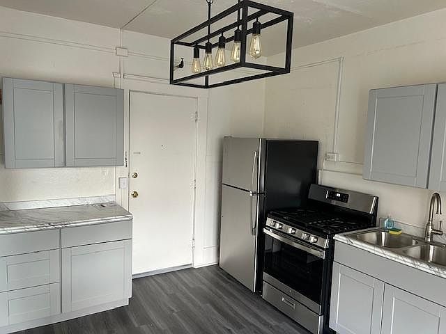 Newly remodeled kitchen with ample cabinet space and counter tops.