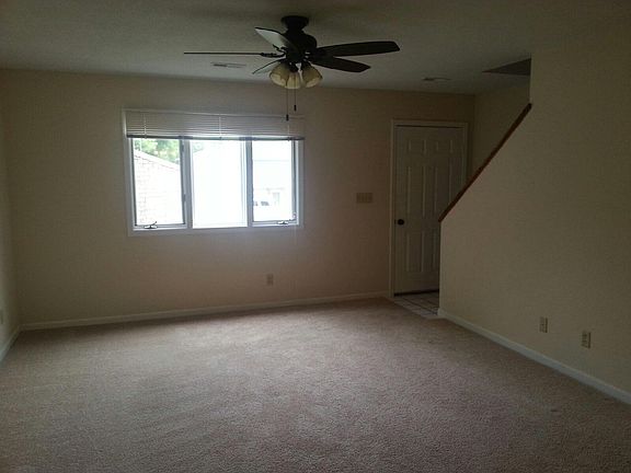This unit has had a flooring upgrade that his not shown in this image. No carpeting at this location, except the steps.