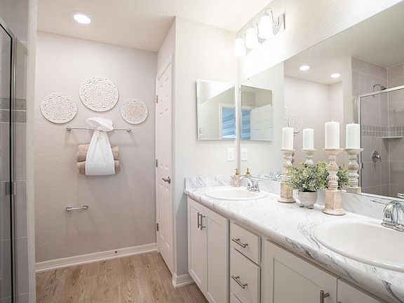 Your suite is complete with an en-suite bath shown with optional dual vanities - Amaryllis home pl