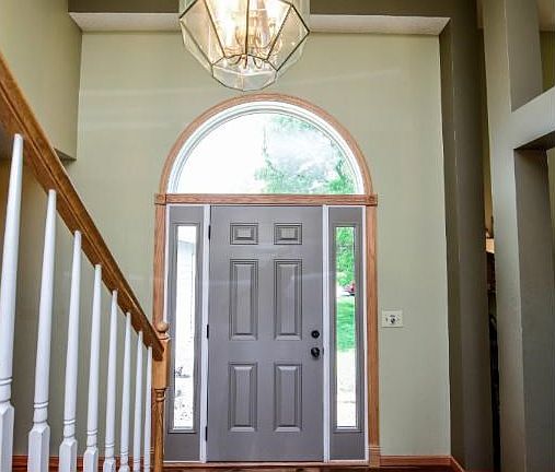 Beautiful entryway with vaulted ceiling and beautiful floors throughout the main floor.