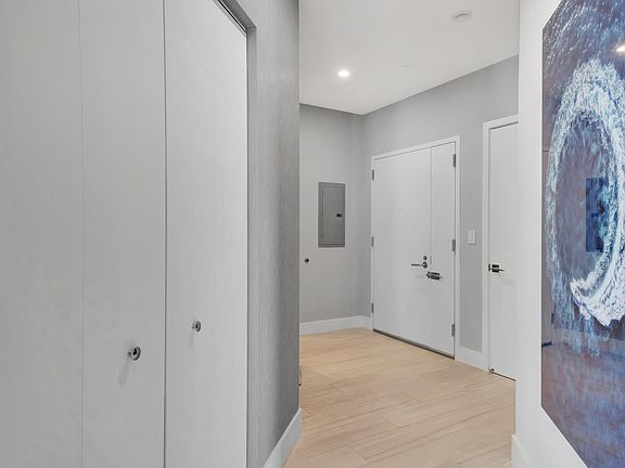 entry with half bath on the left