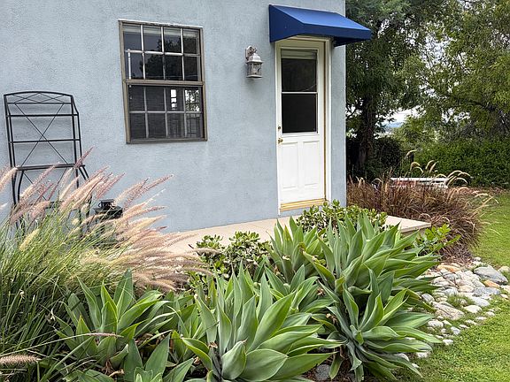 Entry with small deck for plants or chair. 
The studio is in the backyard of the main house. Private and quiet.