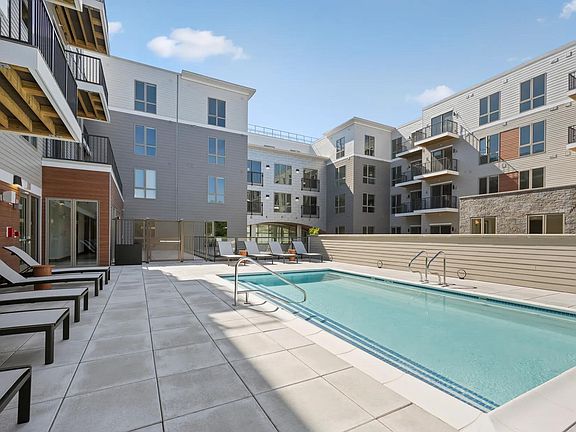 Relax poolside at Modera Newton in Newton, MA.