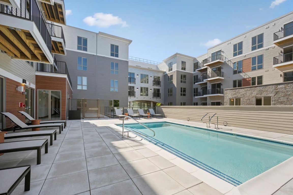 Relax poolside at Modera Newton in Newton, MA.