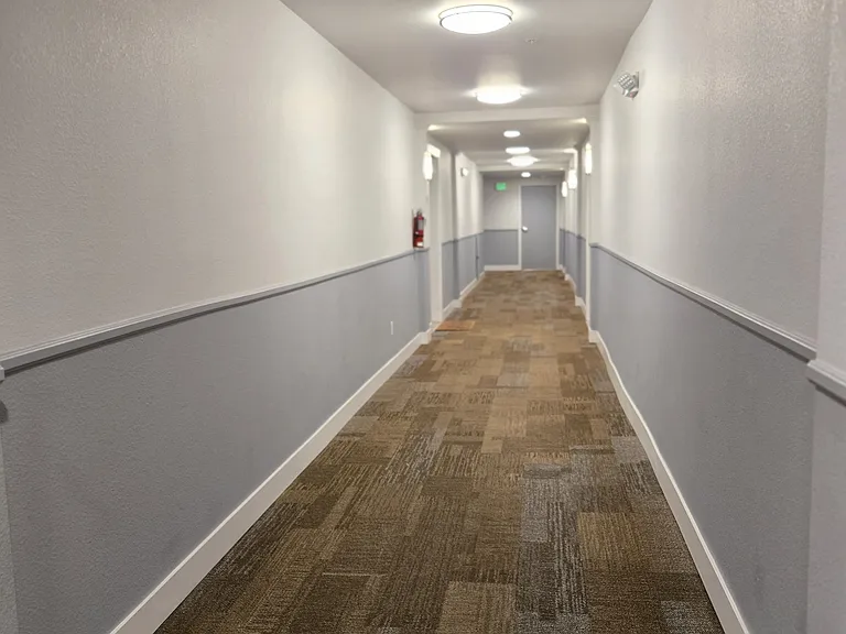 Hallway to condo entryway