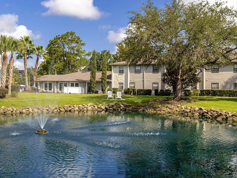 Immerse yourself in a peaceful oasis with soothing waters and verdant surroundings.