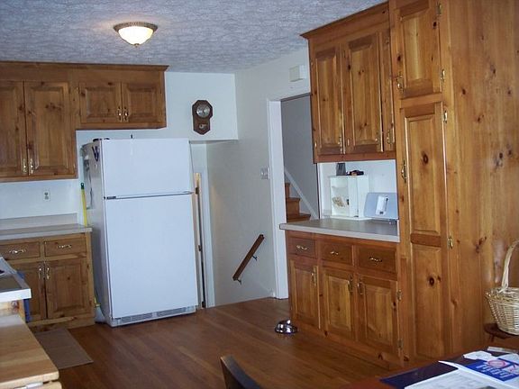 Open kitchen with newer cabinets, wood floors!