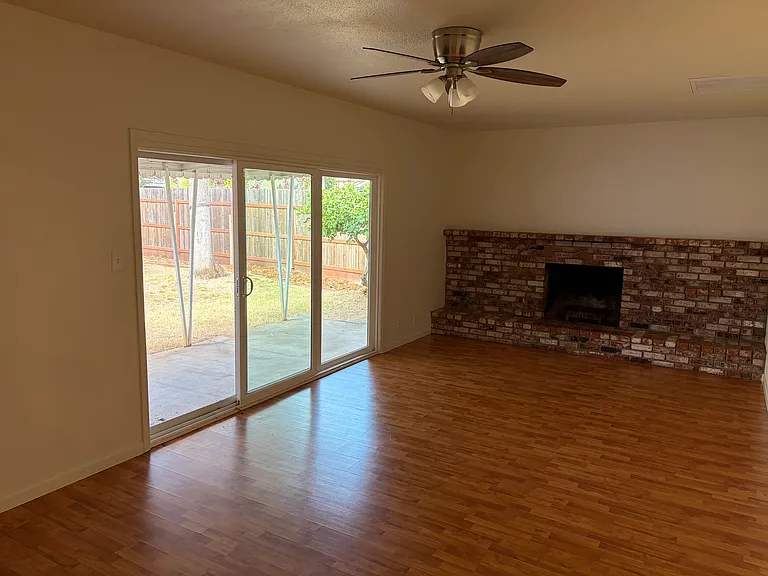 Family room with large slider to patio and backyard