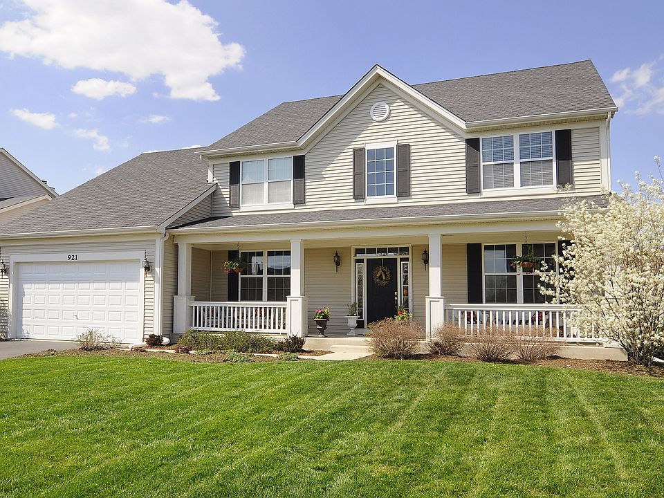 Gorgeous curb appeal greets you with large front porch~manicured landscaping!