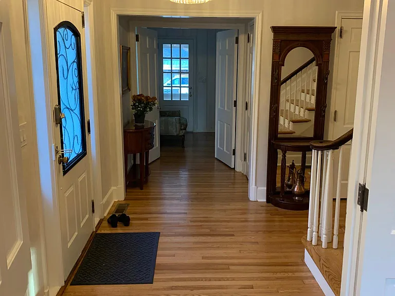 Front foyer leading to library & downstairs master suite