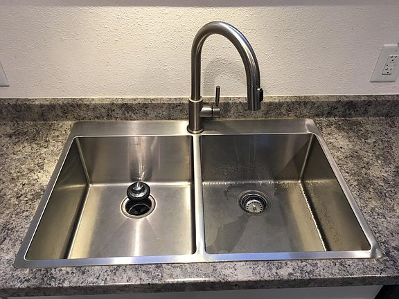 Oversized sink, pull down faucet with garbage disposal