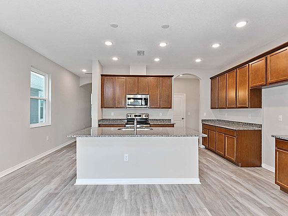 Sandhill home plan new construction home kitchen cafe view at BridgeWater by William Ryan Homes Tamp