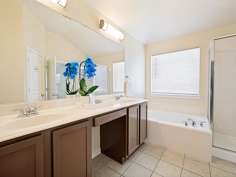 Freshly painted cabinets; vanity area and double sinks