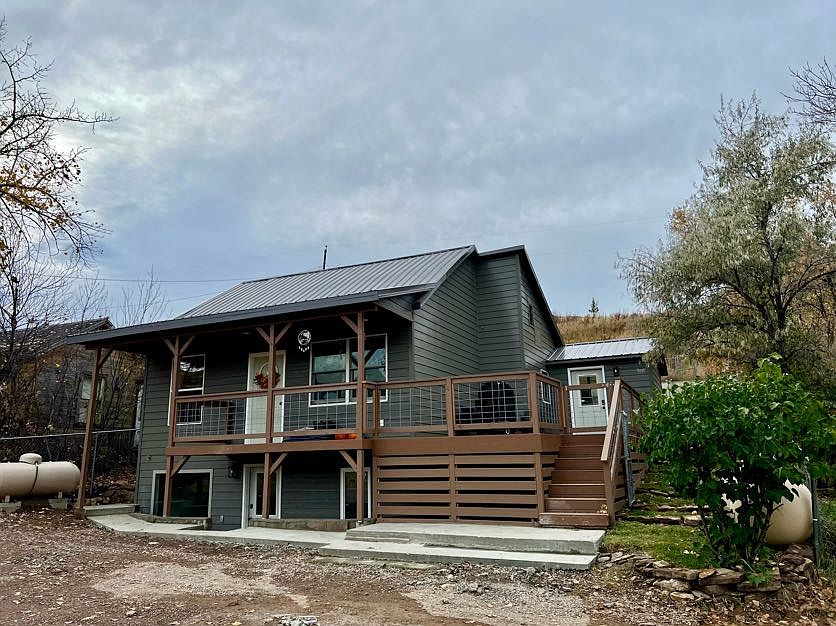 Top and bottom unit duplex, each with a private entrance and a shared fenced-in backyard.