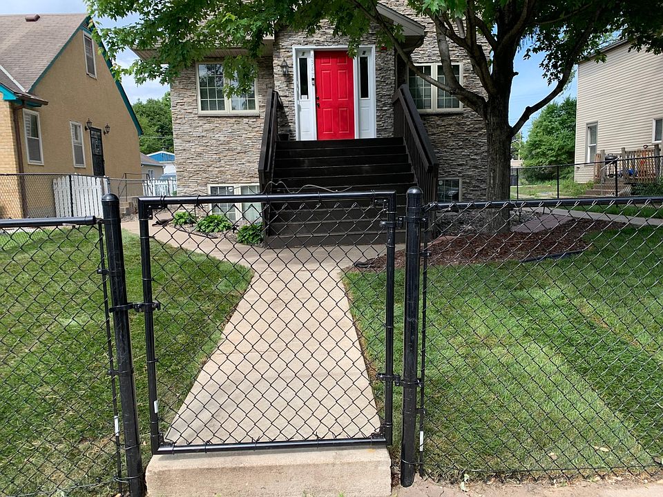 Welcome home! Street view with fence.