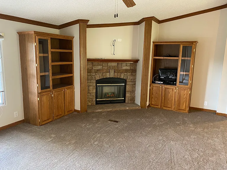 Fireplace and Built-in cabinets. Wired for TV above Fireplace.