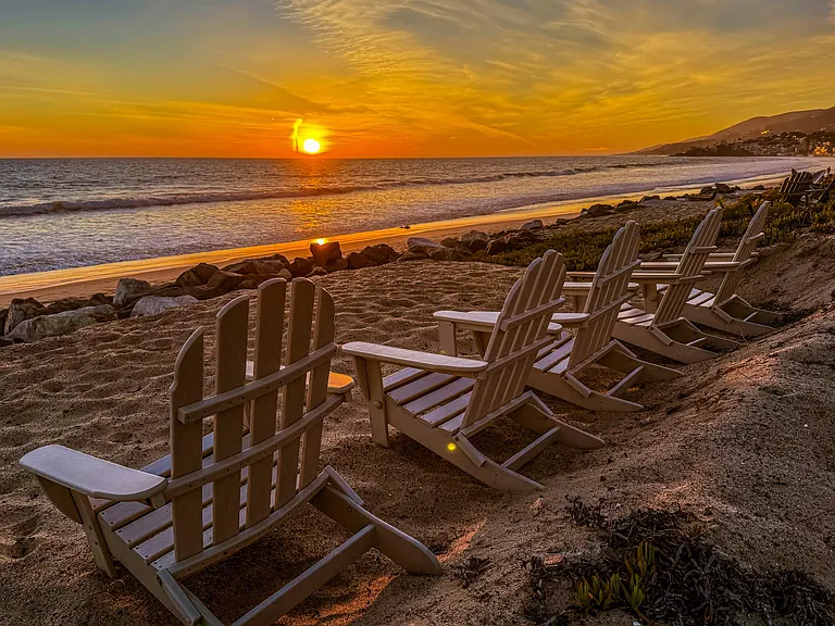 Malibu West Beach Club with chair, umbrellas, parking, lifeguard in summer, bathrooms and hot showers.