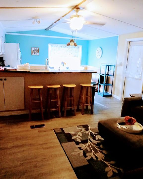 Does home have a nice open concept from Kitchen to the dining room. The gorgeous live slab Cherrywood bar, creates a classic feature.