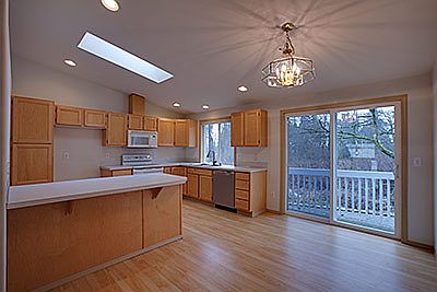 The dining area opens to the kitchen & deck. In addition there is a breafast bar at the huge kitchen