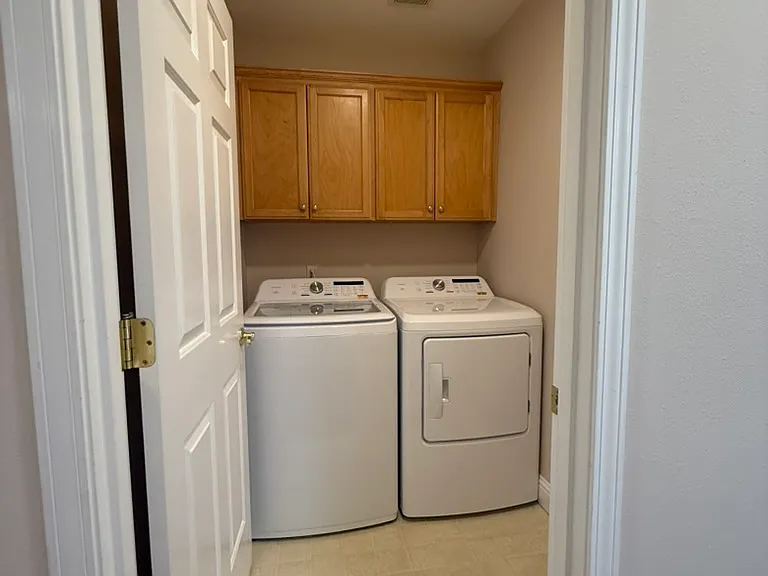 Laundry room with brand new washer and dryer