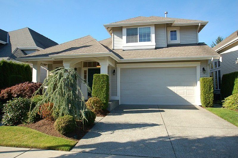 John F Buchan resale in Harbour Pointe Village with great curb appeal and low maintenance yards.