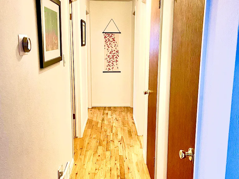 Hallway to three bedroom and bathroom.