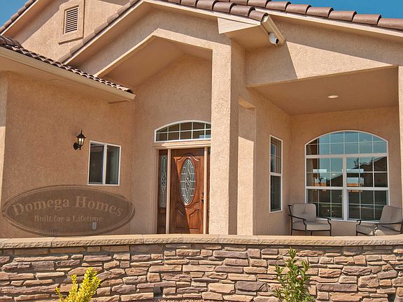 Model shown with upgrades optional 3 car garage extended patio with courtyard wall