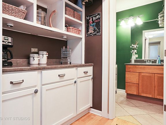 Butler Pantry adjacent to kitchen. Is located just outside the 1/2 bath.