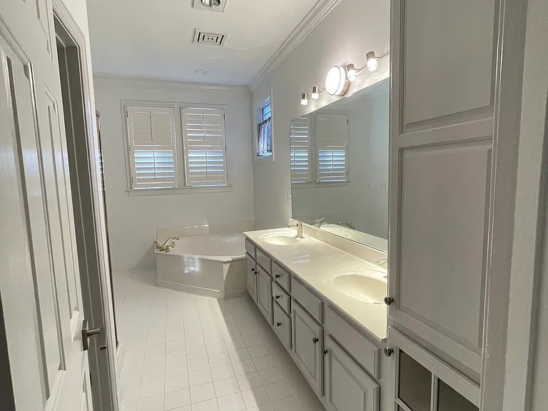 Master bathroom with bathtub and stand shower