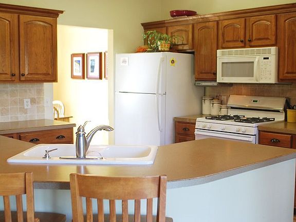 Hickory cabinets with tile back splash.