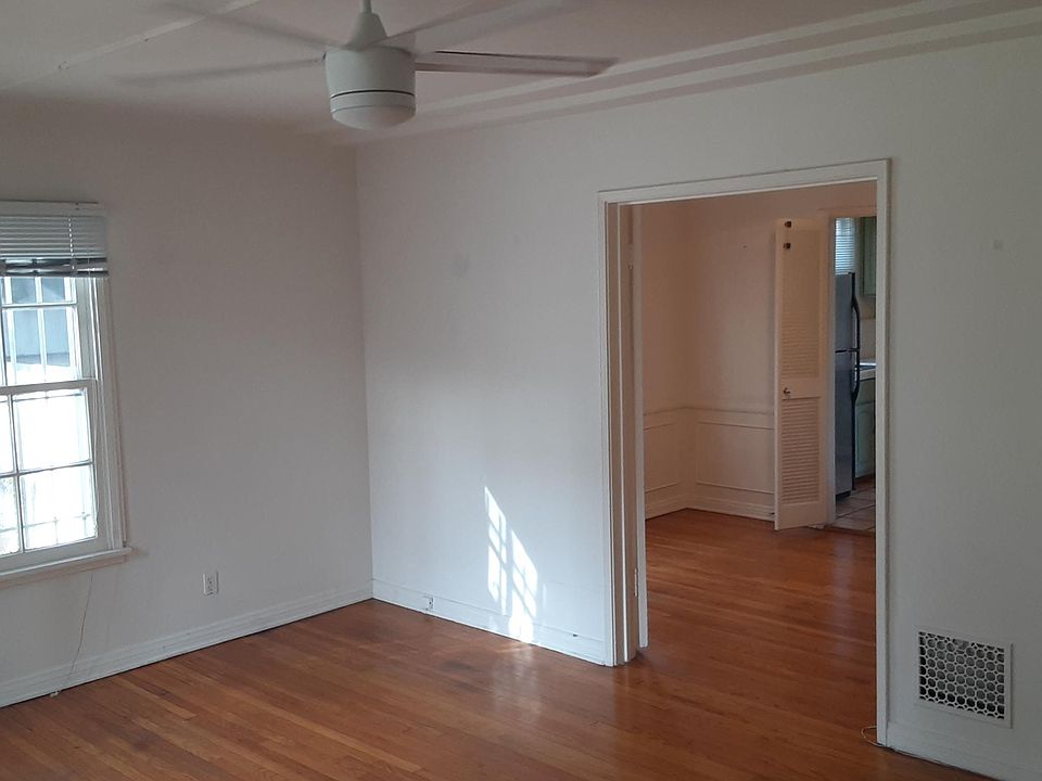View of separate DINING ROOM from the Living Room entrance to Dining Room (The doors close to Dining room to create separate enclosed space).