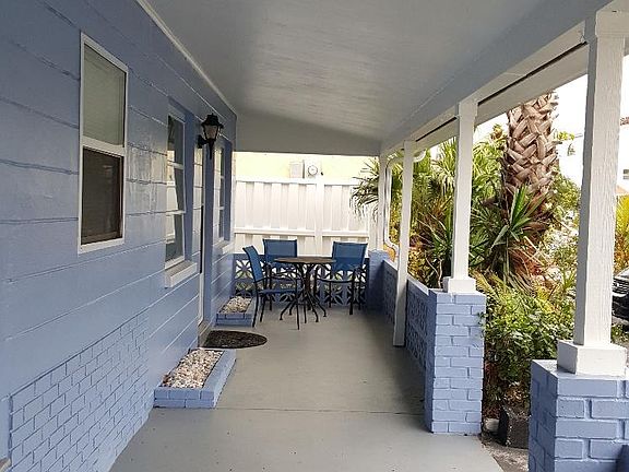 porch with table and chairs