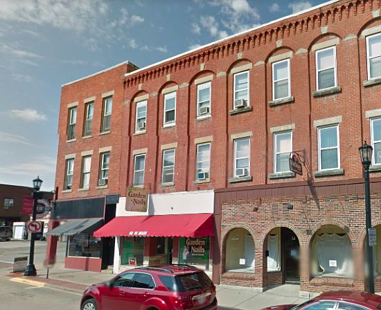 Front of Apartment Building. Apartment above red awning.