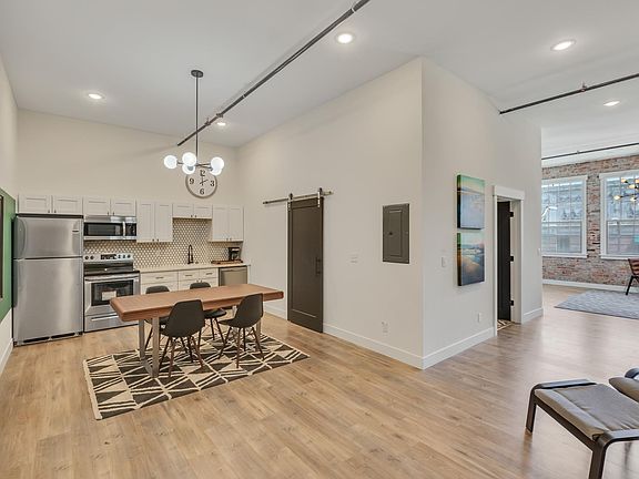 Open floor plan- kitchen is open to living around a wide hall