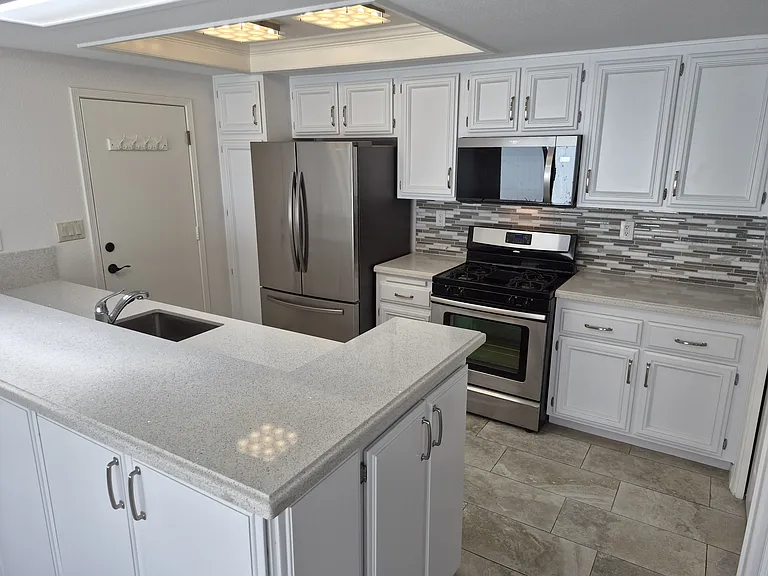 Bright clean kitchen. Cabinetry updated and fully lined. New dishwasher and microwave.