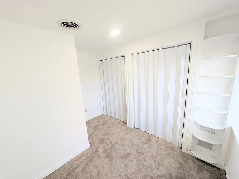 Second bedroom shelving and extra closet space