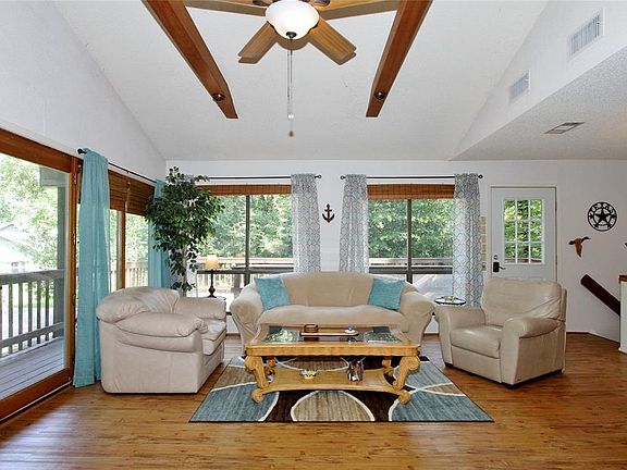 The Living Room offers gorgeous floors and large picture windows that soak in the scenic views.