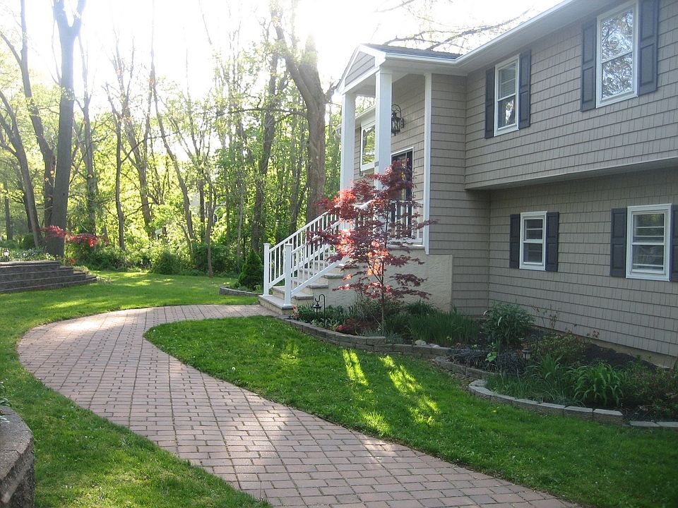 Beautiful paver walkway and new cedar impressions siding!