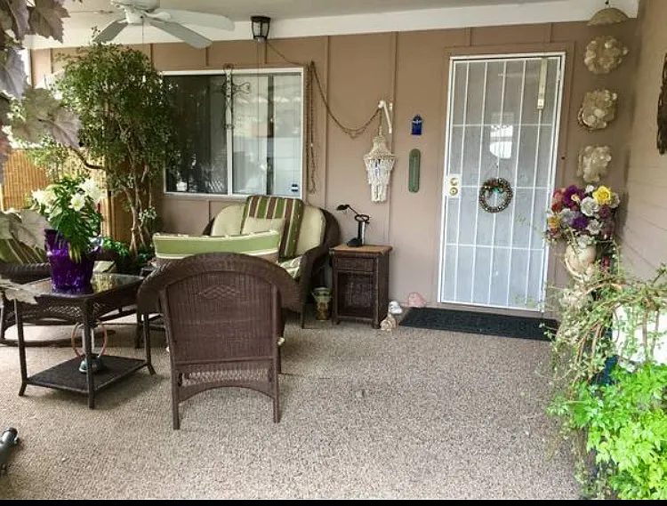 Front screened in carport area with fire pit
