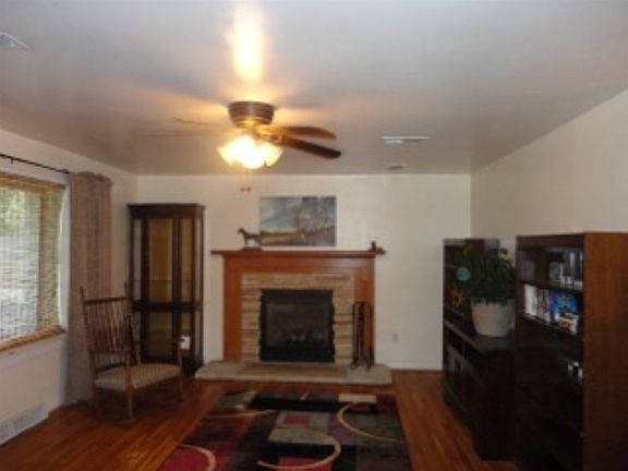 Living room has large picture window, faces West. Gas fireplace, hardwood floors and lots of space.