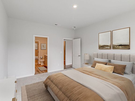 First-floor Owner s Suite with space to relax and a connected Owner s Bath. - Model Representation